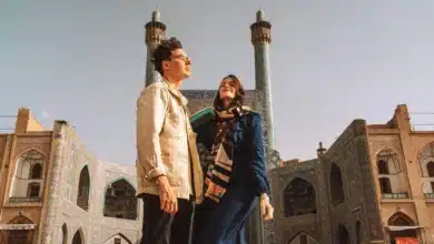 Stylish young couple standing near Jameh Mosque of Yazd