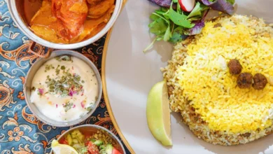Traditional Iranian Dishes And Snacks Polow, Kufte, Fresh Vegetable Salad And Yogurt