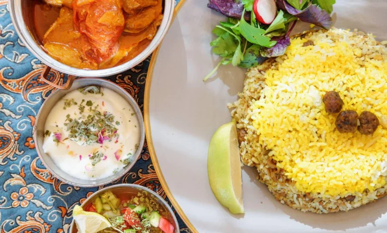 Traditional Iranian Dishes And Snacks Polow, Kufte, Fresh Vegetable Salad And Yogurt